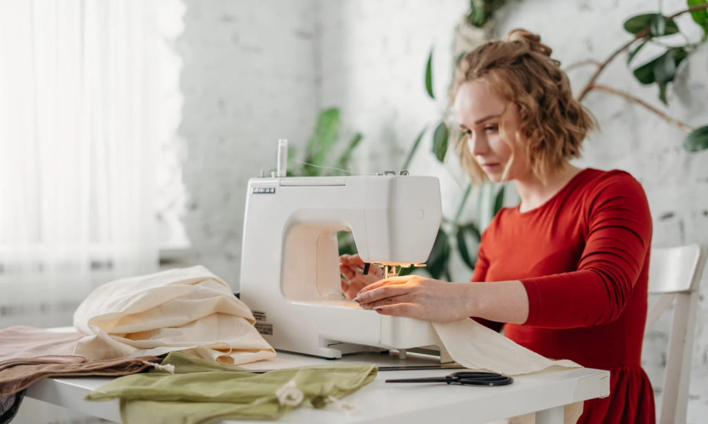 A photo of a woman sewing with a machine