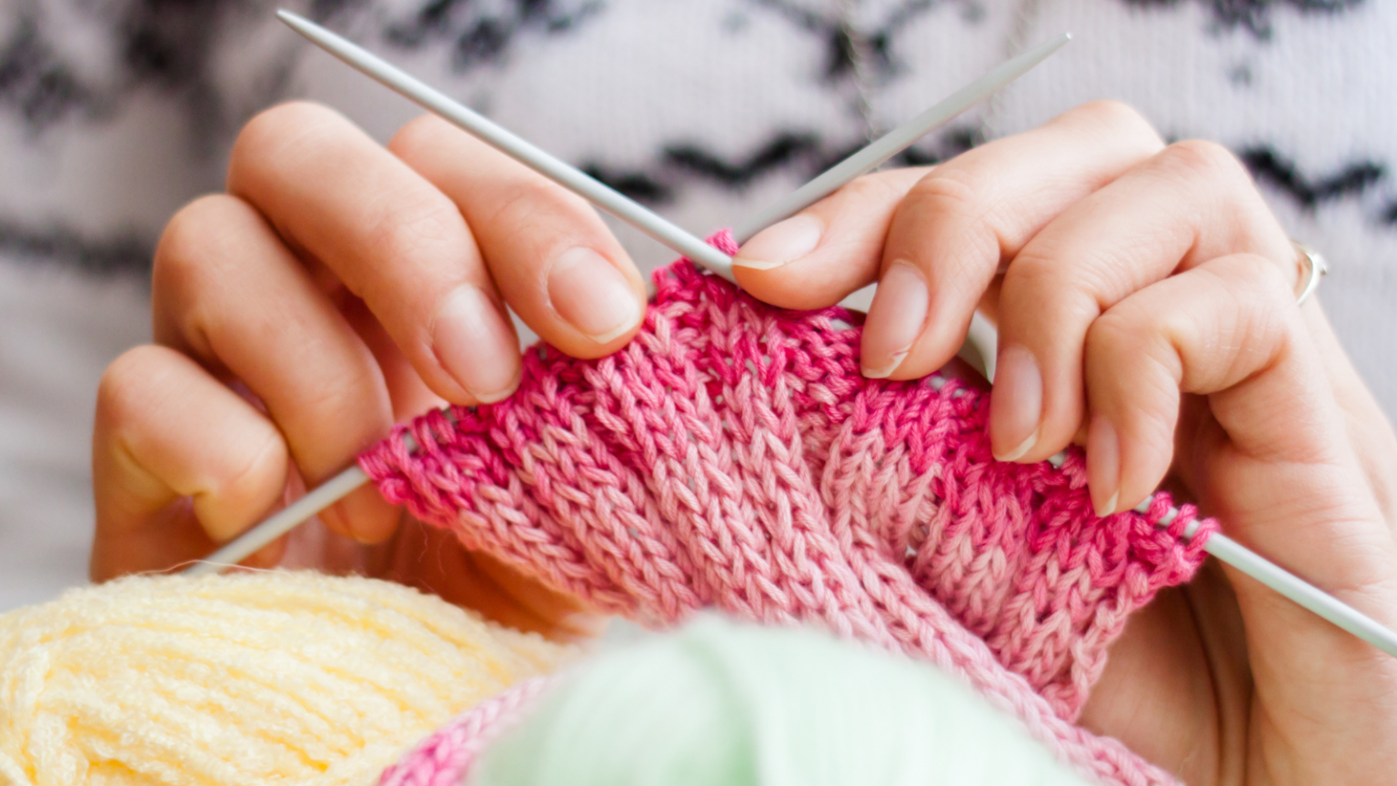 A photo of knitting hands.